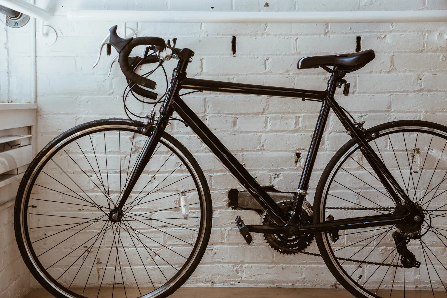 Picture of a black road bicycle. 